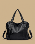 Sac cabas Yube en cuir clouté à pompon